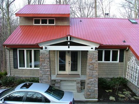 red house with siding and metal roof|red roof interior design.